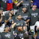 Justin Turner joined his teammates for post-game celebrations despite being removed from the World Series clinching game due to COVID-19.